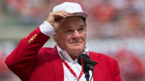 Pete Rose wearing a Reds cap