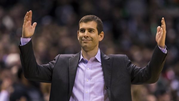 Celtics president Brad Stevens with his arms extended