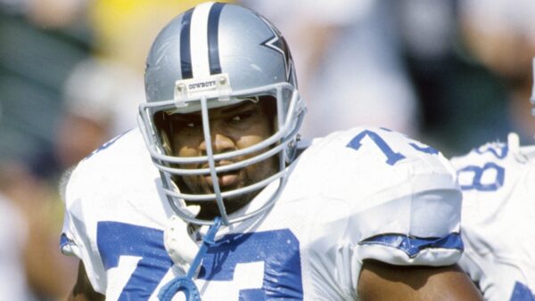 Larry Allen looks on after a play