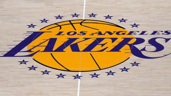 The Lakers logo at half court