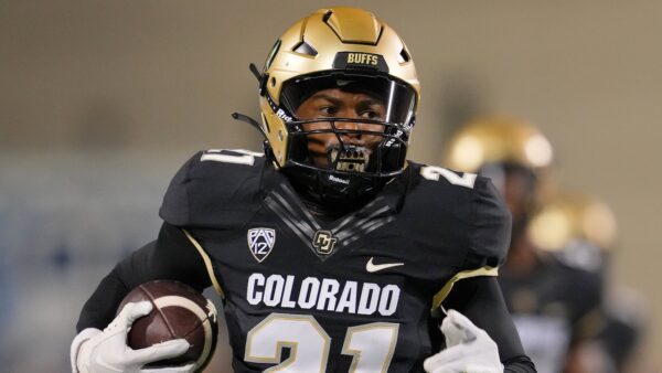 Shilo Sanders holding a ball