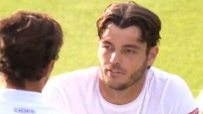 Taylor Fritz looks across the net