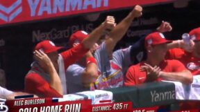 Cardinals players raise their arms