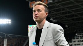 Canada women's soccer head coach Beverly Priestman holding a bottle