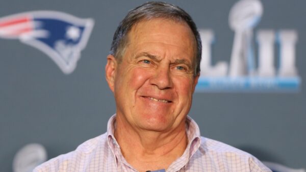 Bill Belichick smiles at the podium