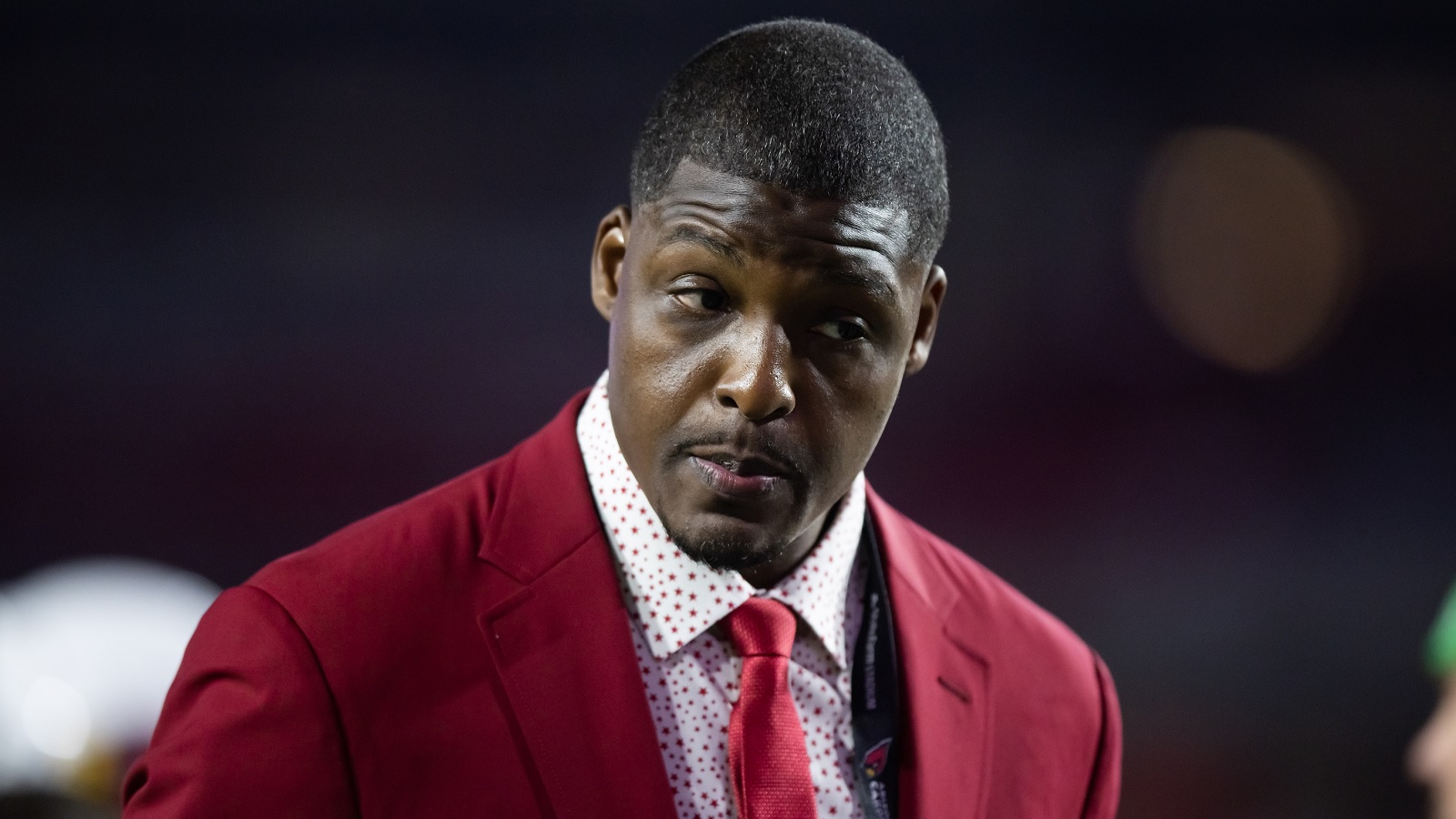 Adrian Wilson wearing a red suit