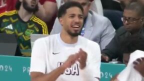 Tyrese Haliburton claps on the bench