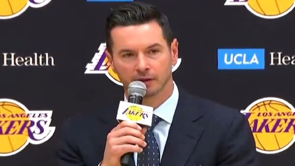 JJ Redick holds a microphone