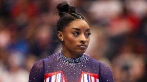 Simone Biles looks to the side