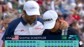 Scottie Scheffler puts his arm around Tom Kim