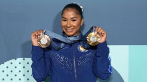 Jordan Chiles showing off her Olympic medals