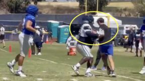 Albert Huggins shoves a Rams staffer