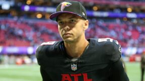 Desmond Ridder wearing a Falcons cap