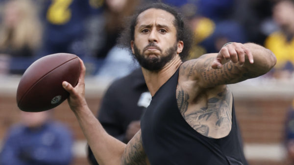 Colin Kaepernick throws a pass