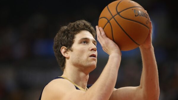 Jimmer Fredette shooting a ball