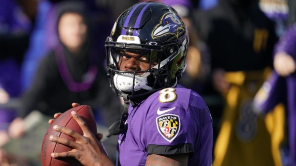 Lamar Jackson warms up before a game