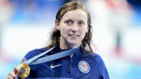 Katie Ledecky holding a gold medal