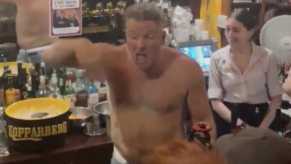 Pat McAfee shirtless at a bar in Ireland