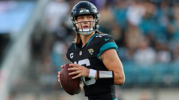 Trevor Lawrence holds the ball