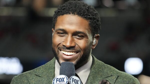 Reggie Bush holding a microphone